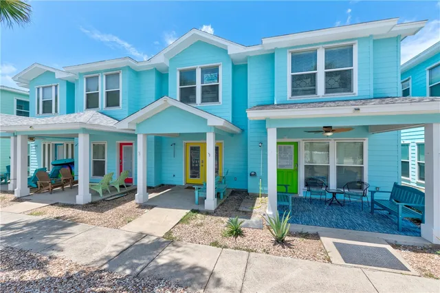 an aerial view of a house with a garden