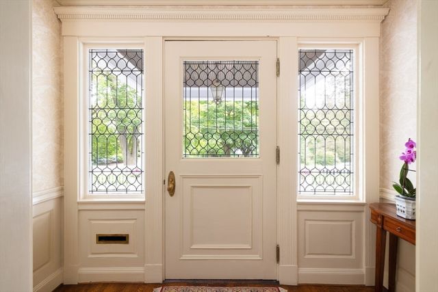 a view of entryway with wooden floor