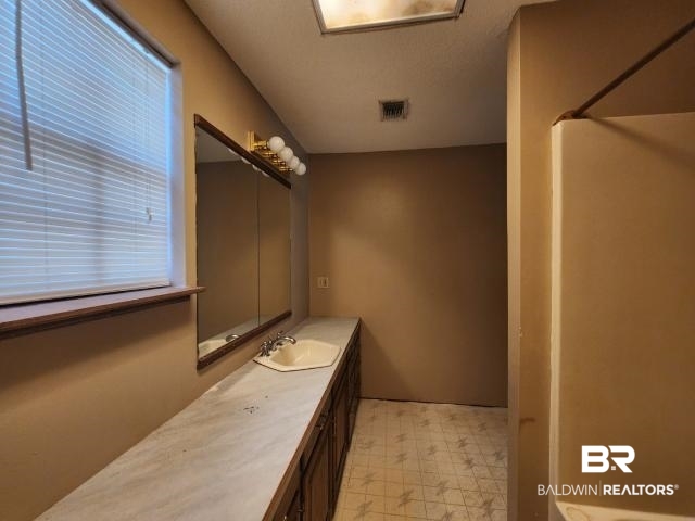 32749 Antietam Road Lillian, AL 36549 - Photo 32 of 47 Bathroom with walk in shower and vanity