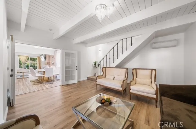 a living room with furniture or couch and a dining table