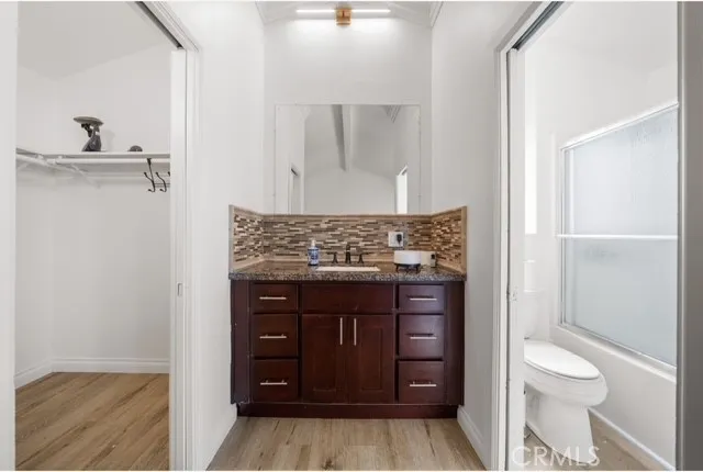 a bathroom with a toilet and a sink