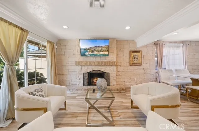a living room with furniture and a fireplace