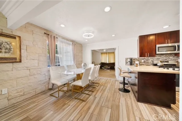 a living room with a couch and a wooden floor