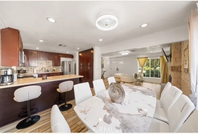 a large white kitchen with a large window