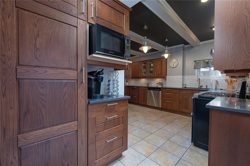 608 Blackburn Road Sewickley, PA 15143 - Photo 13 of 24 Additional features such as a pantry, built-in microwave, and coffee bar are special touches.