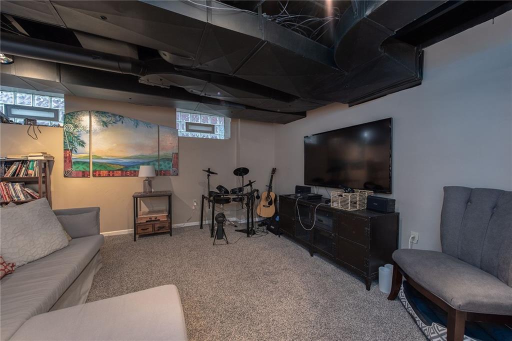 608 Blackburn Road Sewickley, PA 15143 - Photo 22 of 24 The family room in the finished basement adds entertainment space.