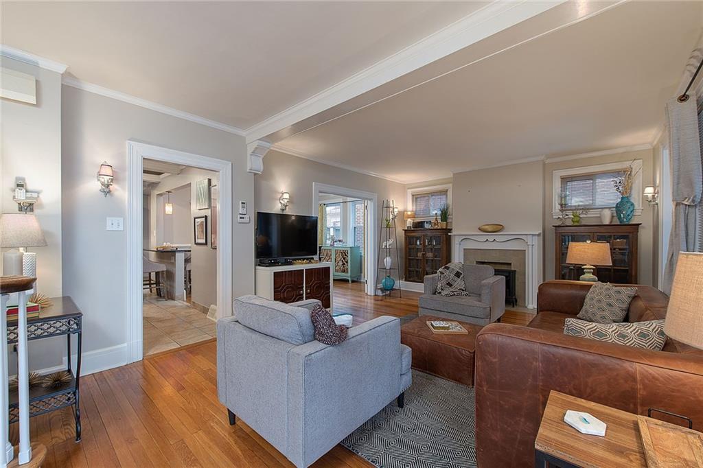 The living room is spacious with a gas fireplace and beautiful wood built-ins.