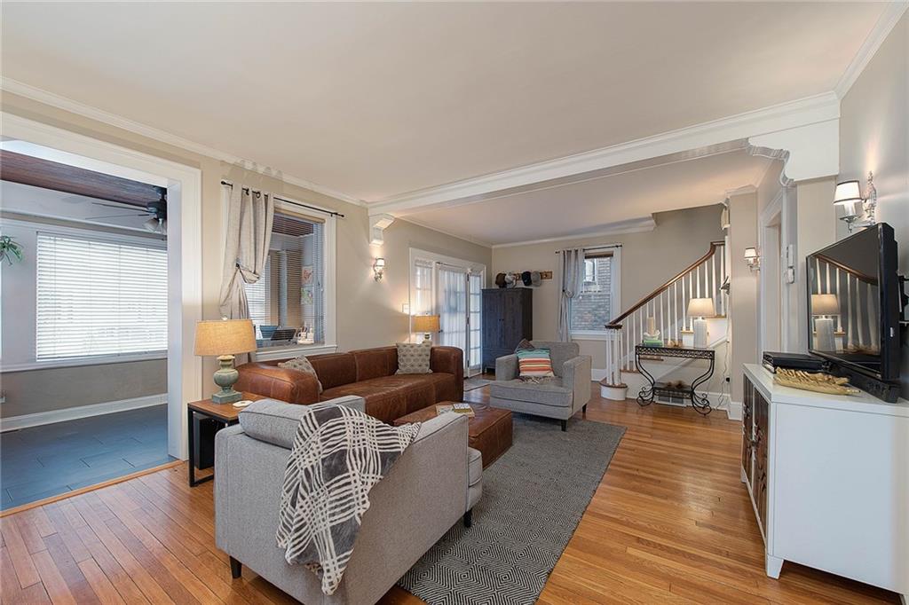 Warm hardwood floors flow throughout the living and dining room.