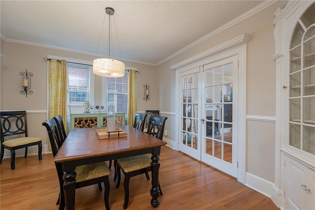 608 Blackburn Road Sewickley, PA 15143 - Photo 9 of 24 The dining room holds a lovely built-in hutch and opens to the living room with glass French doors.