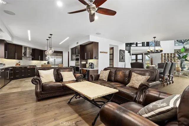 a kitchen with granite countertop a stove and a refrigerator