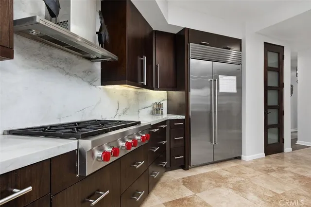 a bedroom with a bed and a flat tv screen