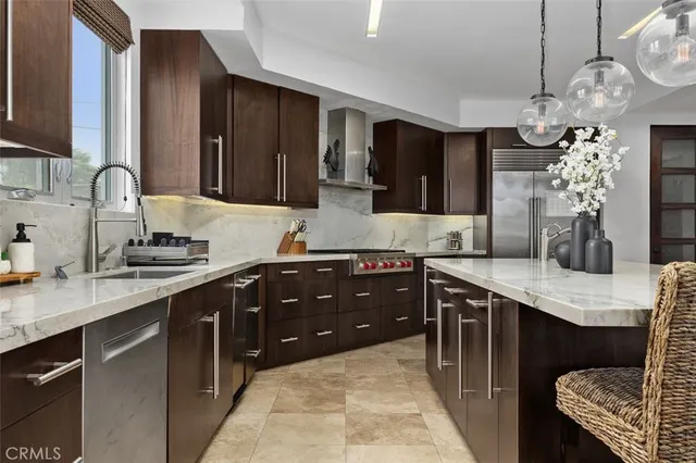 a bedroom with a large bed couch and a window