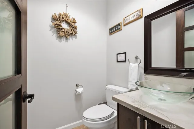 a bathroom with a granite countertop sink a large mirror and shower