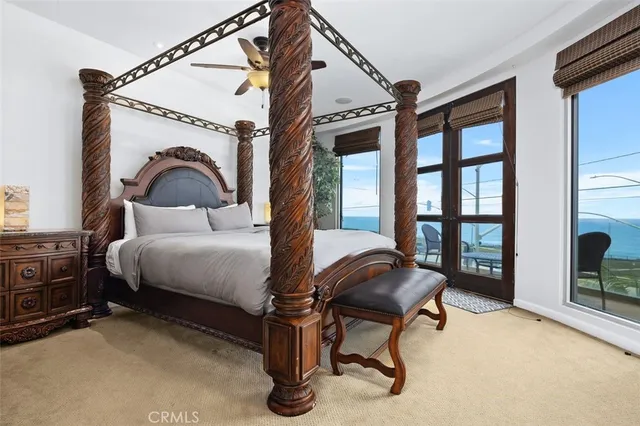 a view of a living room with furniture and a large window