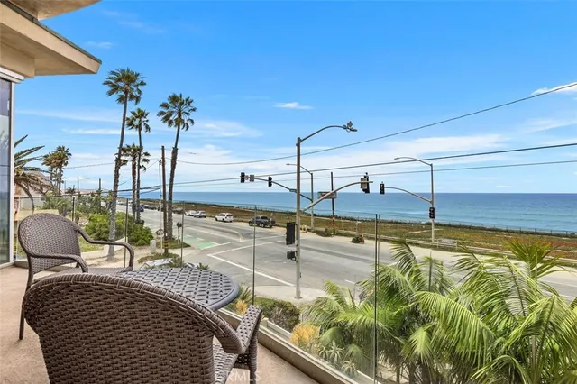 a bathroom with a granite countertop toilet a sink and mirror