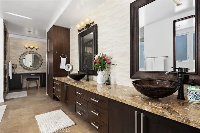 a bedroom with a bed couch and window