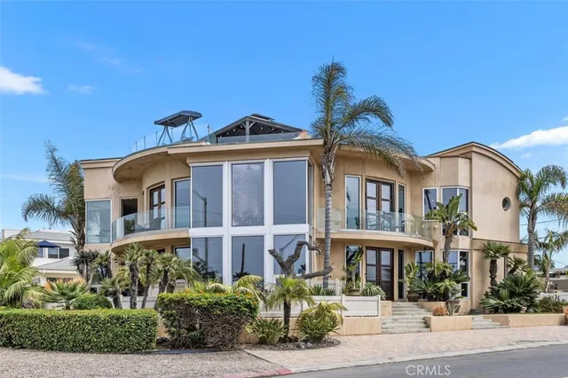 a view of a livingroom with lounge chair and a large window