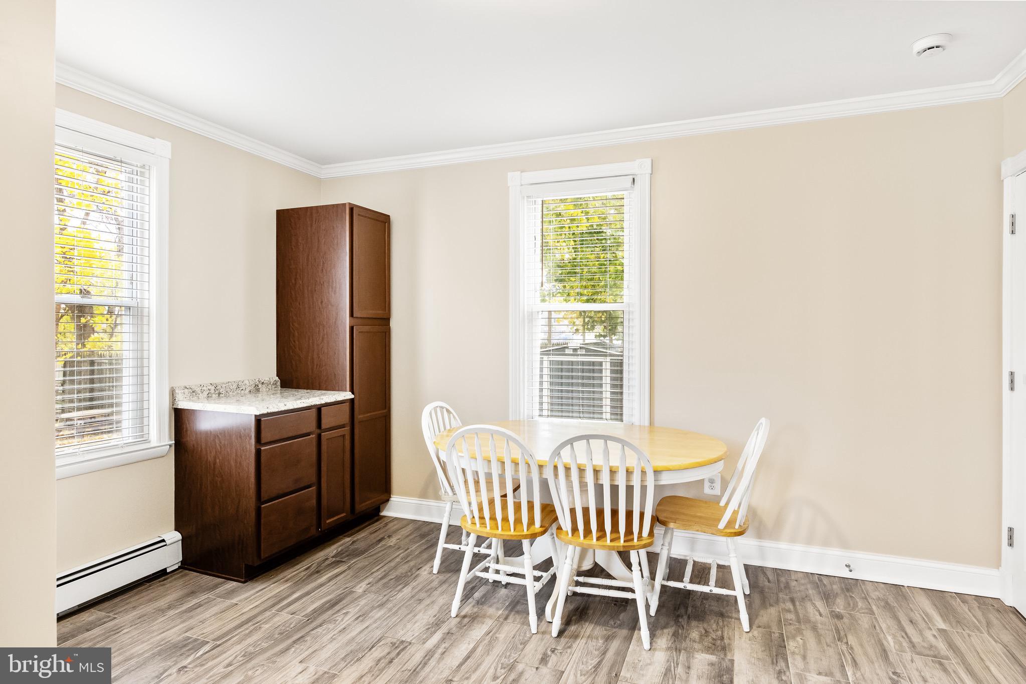 511 Ash Street Delanco, NJ 08075 - Photo 14 of 30 a view of a dining room with furniture and windows