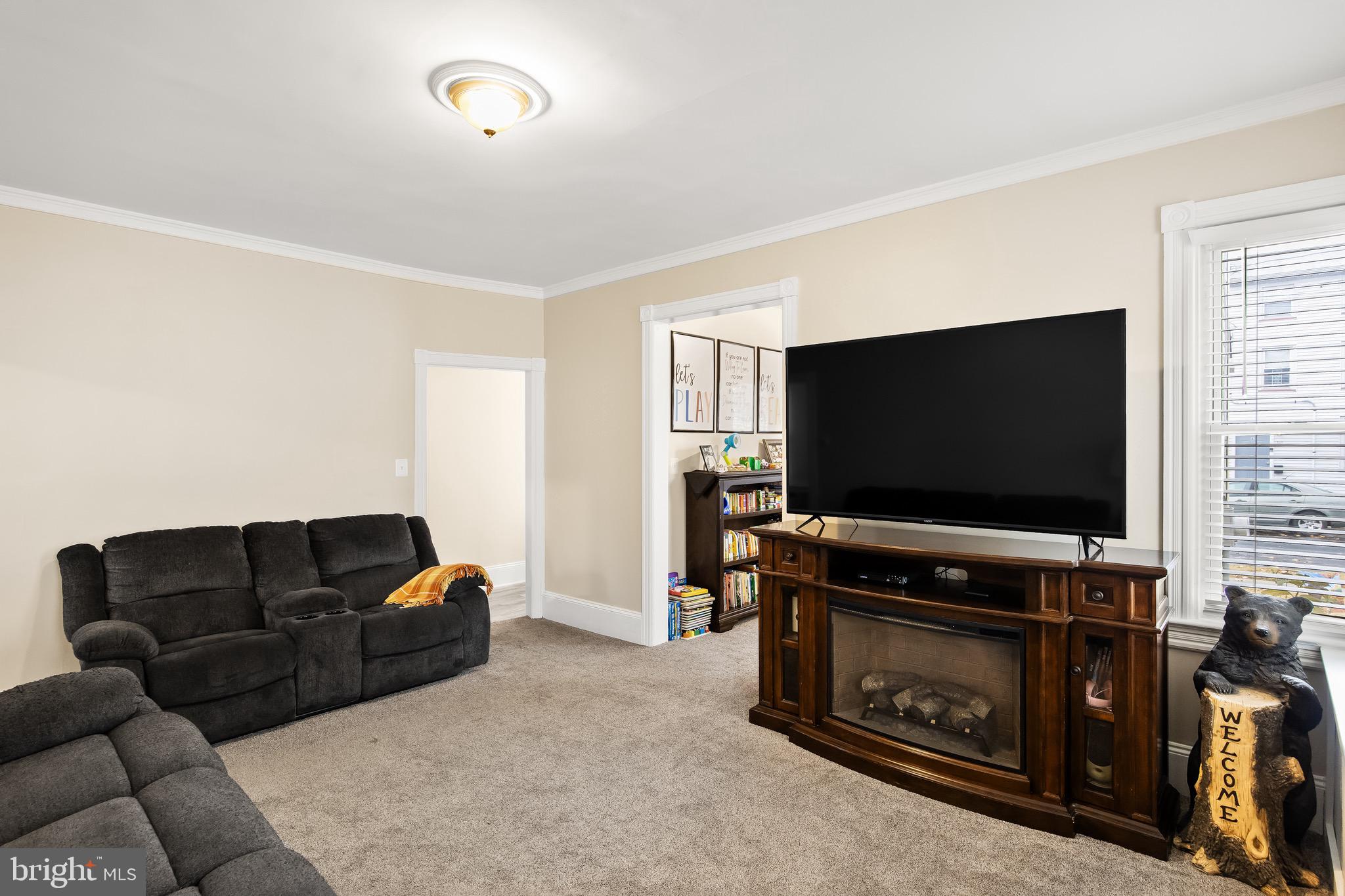 511 Ash Street Delanco, NJ 08075 - Photo 16 of 30 a living room with furniture and a flat screen tv