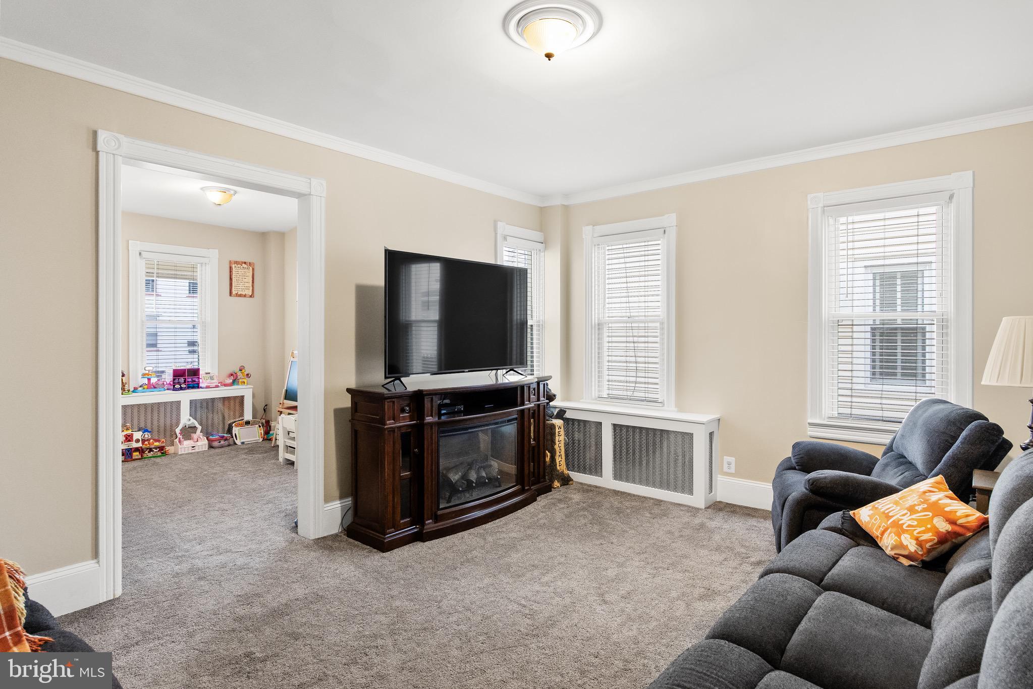 511 Ash Street Delanco, NJ 08075 - Photo 17 of 30 a living room with furniture and a flat screen tv