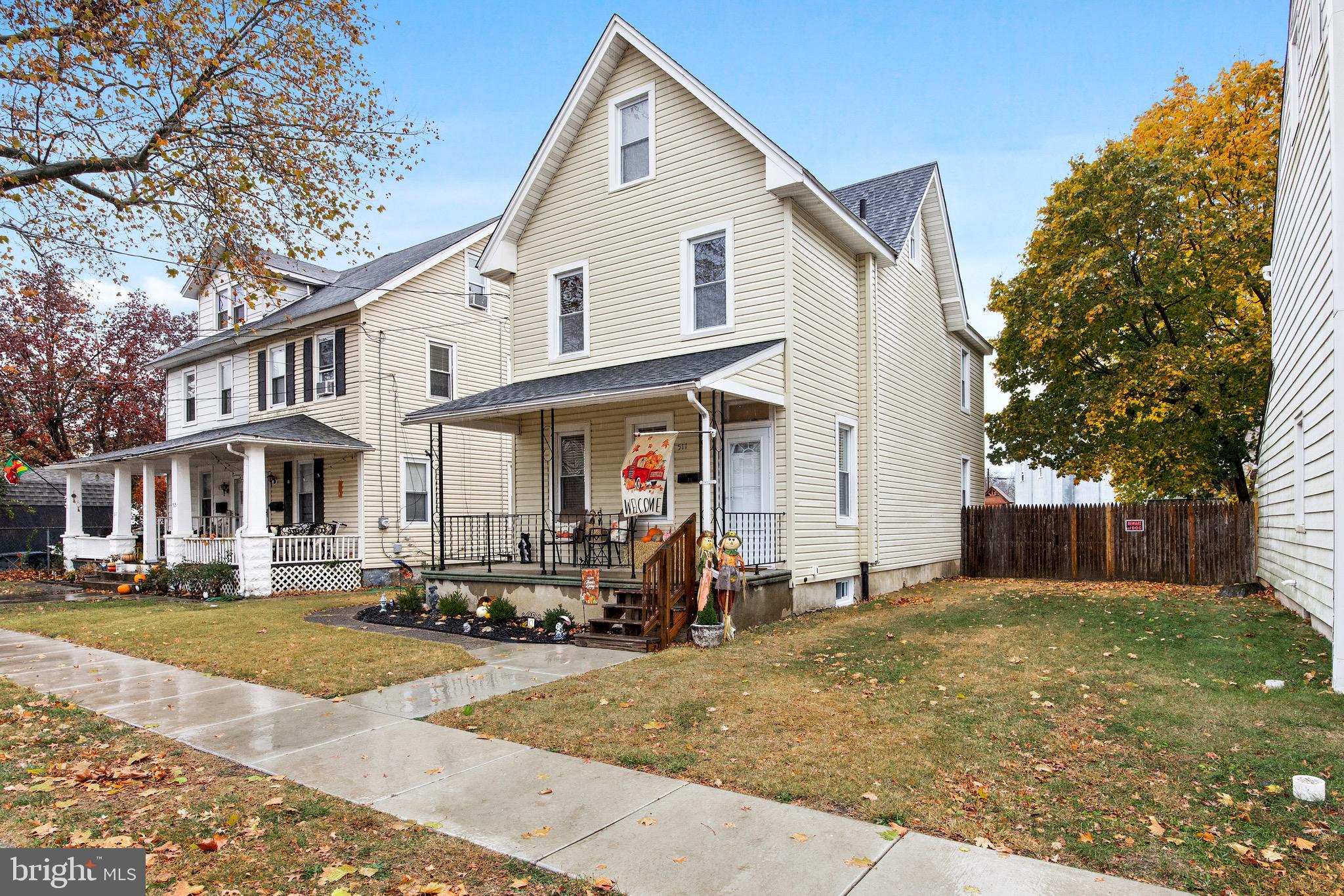 511 Ash Street Delanco, NJ 08075 - Photo 2 of 30 a view of a white house next to a yard with trees
