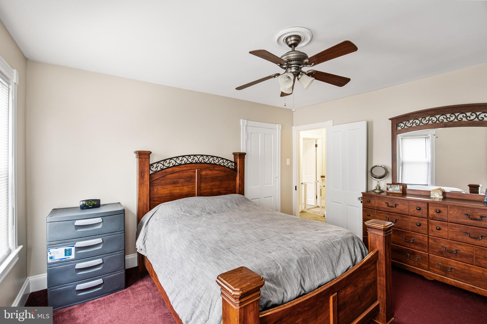 511 Ash Street Delanco, NJ 08075 - Photo 23 of 30 a bedroom with a bed and dresser with mirror