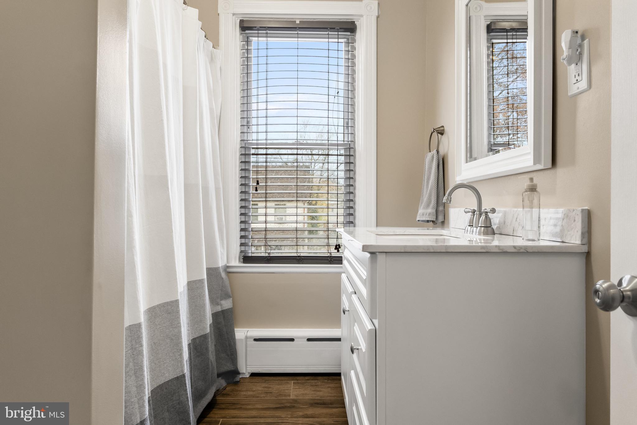 511 Ash Street Delanco, NJ 08075 - Photo 26 of 30 a bathroom with a sink and a mirror