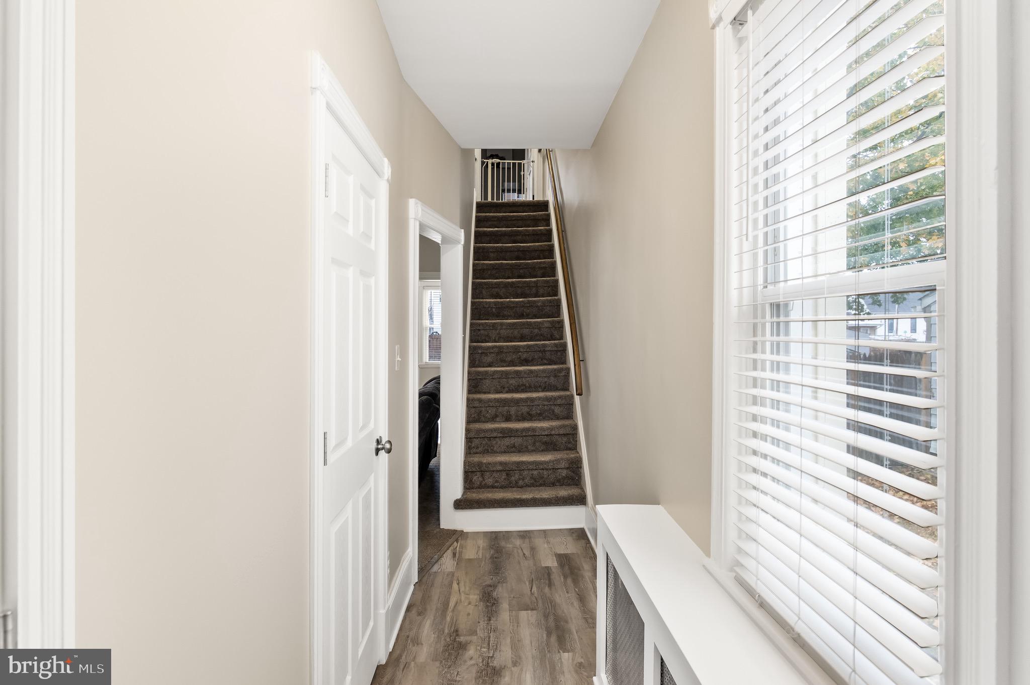 511 Ash Street Delanco, NJ 08075 - Photo 8 of 30 a view of a hallway with stairs and a window
