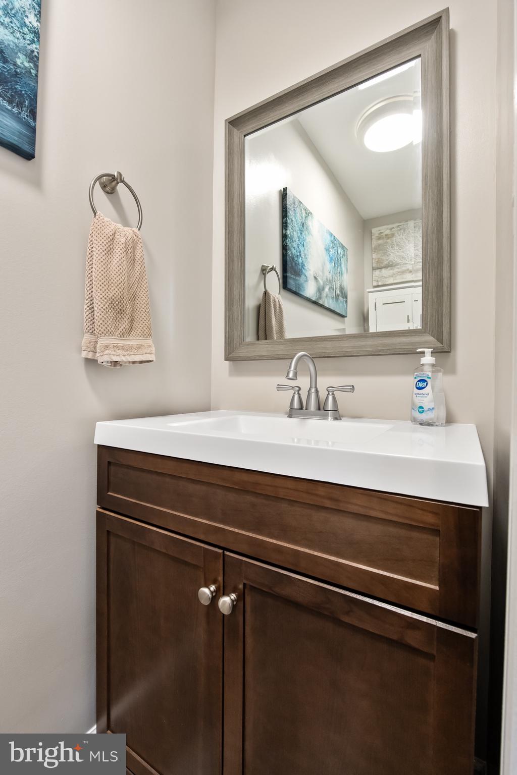 511 Ash Street Delanco, NJ 08075 - Photo 9 of 30 a bathroom with a sink and a mirror