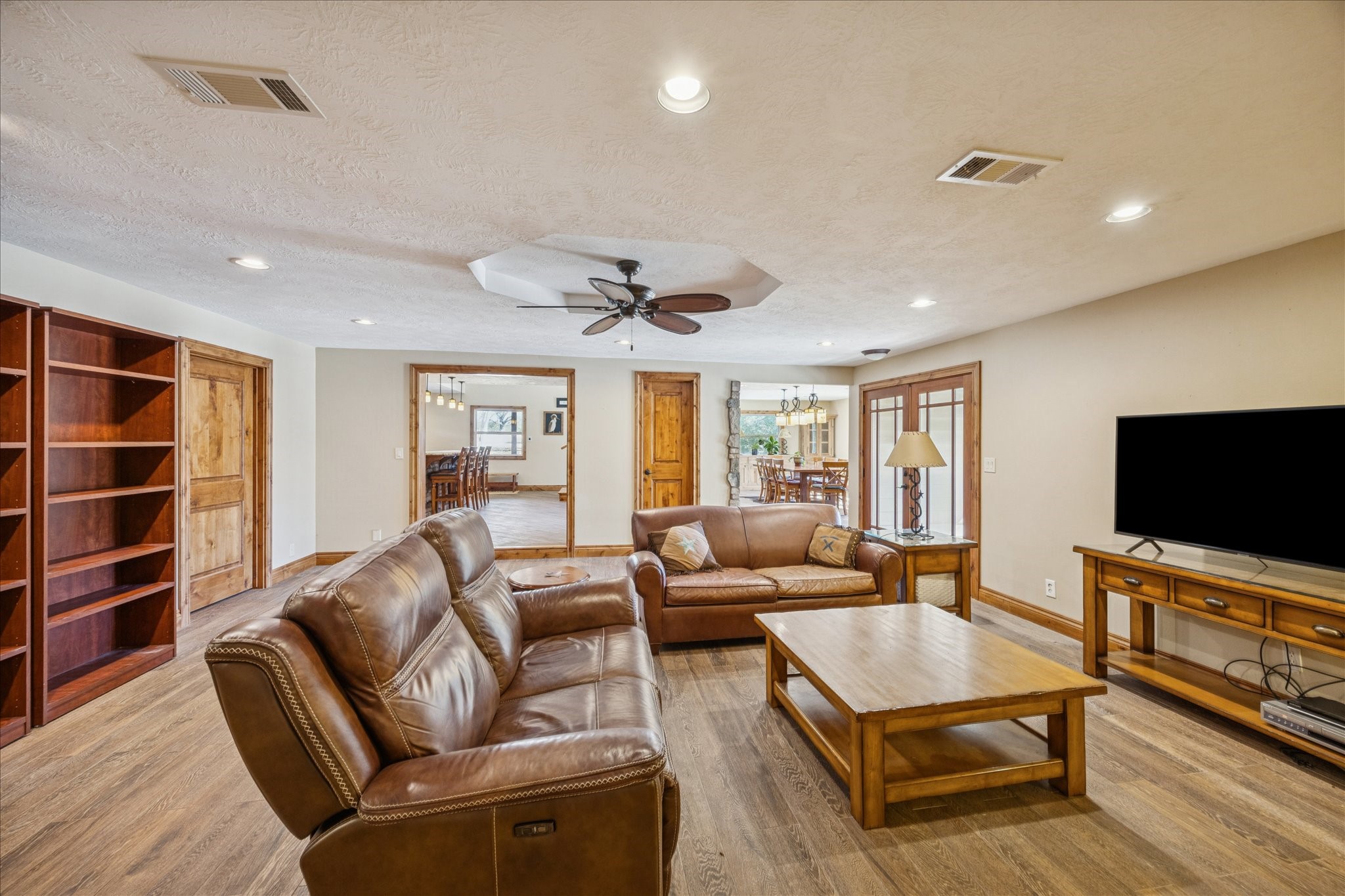 640 Piney Creek Road Bellville, TX 77418 - Photo 10 of 35 a living room with furniture and a flat screen tv
