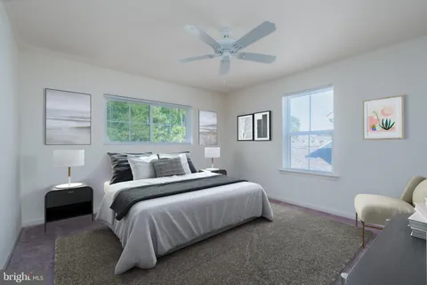 a bedroom with a bed and a large mirror
