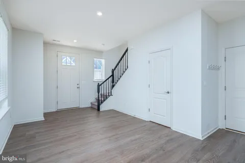 a view of entryway with wooden floor