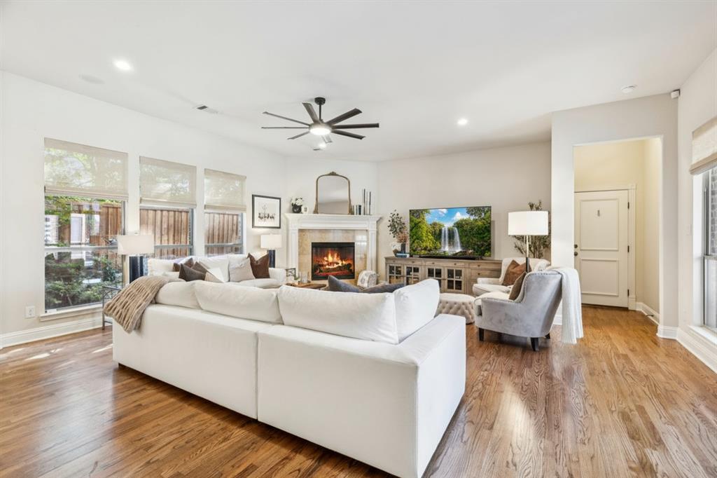 1715 San Jacinto Drive Allen, TX 75013 - Photo 11 of 33 a living room with furniture a fireplace and a flat screen tv