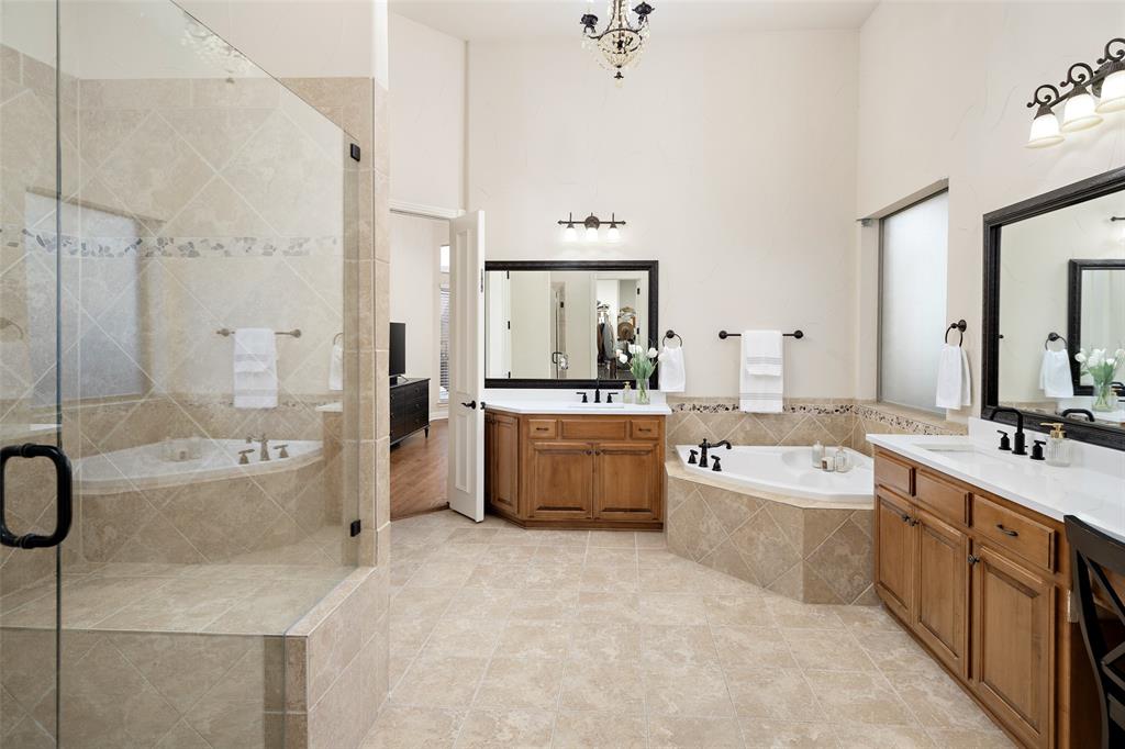 1715 San Jacinto Drive Allen, TX 75013 - Photo 15 of 33 a large bathroom with a double vanity sink a large mirror and a bathtub