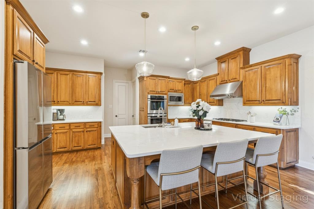 1715 San Jacinto Drive Allen, TX 75013 - Photo 4 of 33 a kitchen with a table chairs refrigerator and cabinets