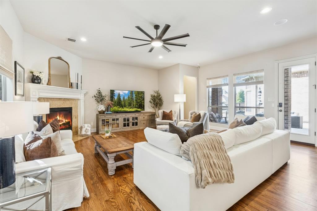 1715 San Jacinto Drive Allen, TX 75013 - Photo 8 of 33 a living room with furniture fireplace and a large window