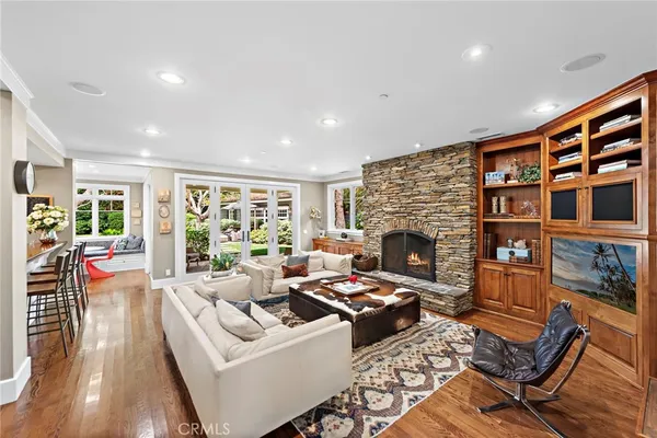 a dining room with furniture a flat screen tv and a floor to ceiling window