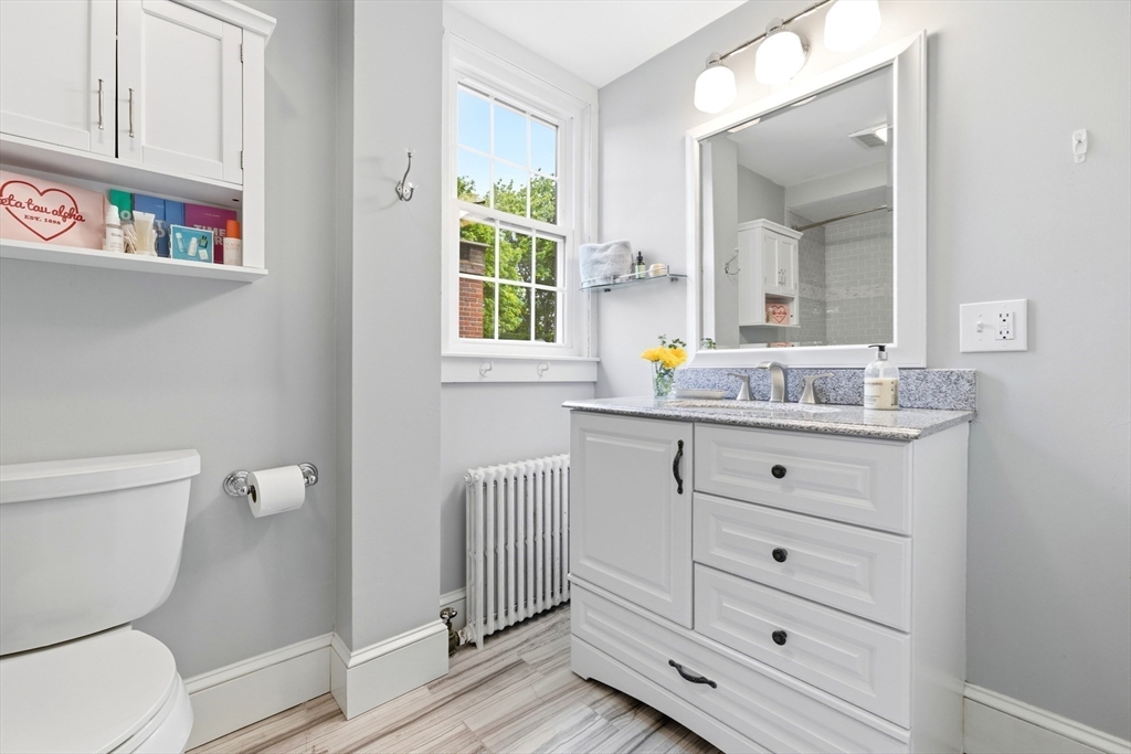 22 Stinson Road Andover, MA 01810 - Photo 31 of 40 a bathroom with a granite countertop toilet sink and mirror