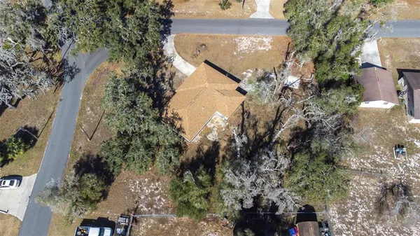 an aerial view of house with yard