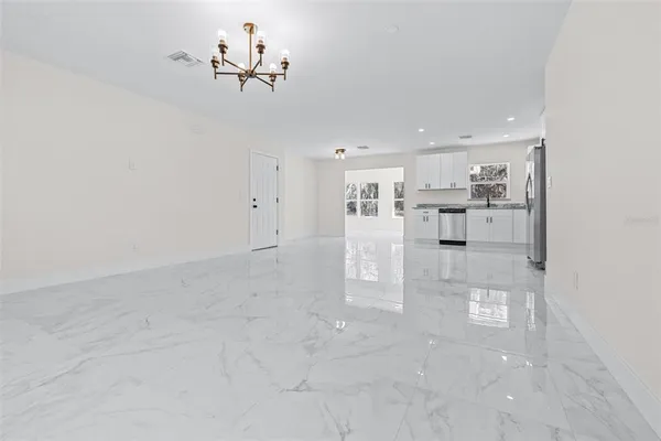 a view of kitchen with center island and stainless steel appliances