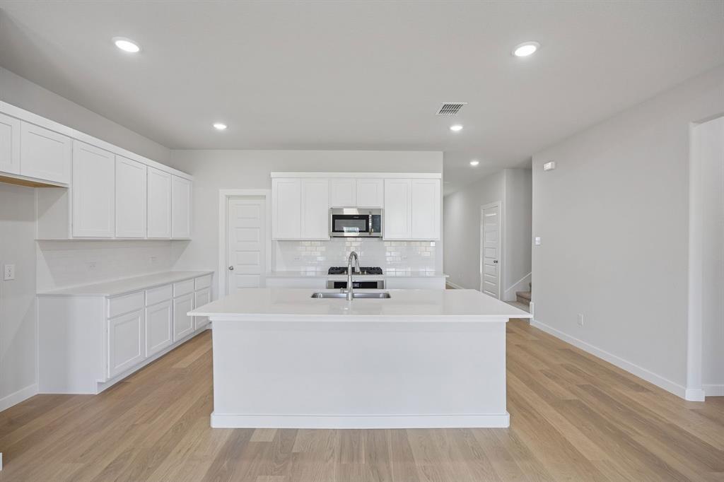 1432 Companero Street Haslet, TX 76052 - Photo 9 of 36 Kitchen in the Masters home plan by Trophy Signature Homes – REPRESENTATIVE PHOTO