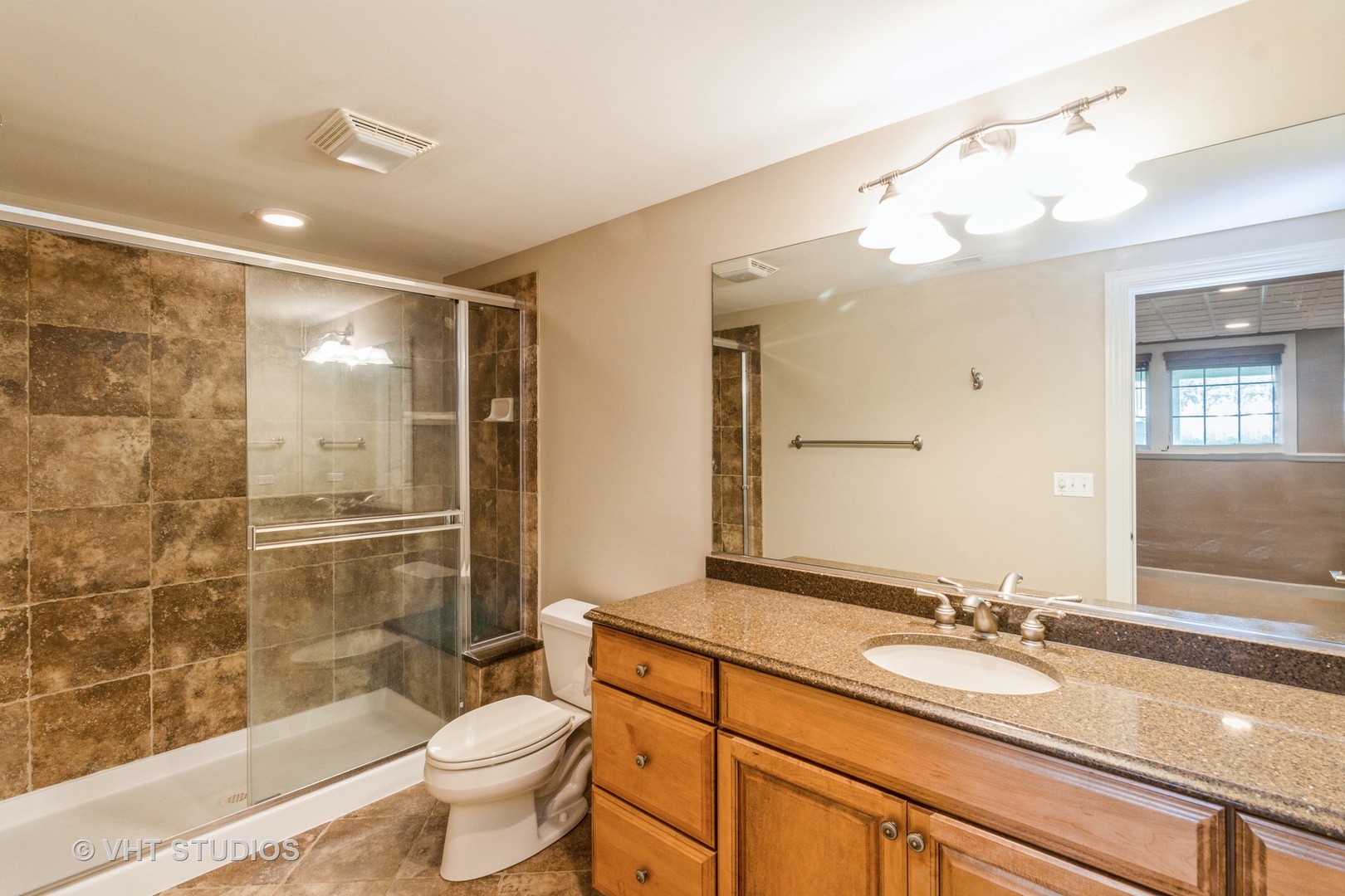 1 Sugar Maple Court Lake In The Hills, IL 60156 - Photo 19 of 29 a bathroom with a sink a toilet a mirror and shower