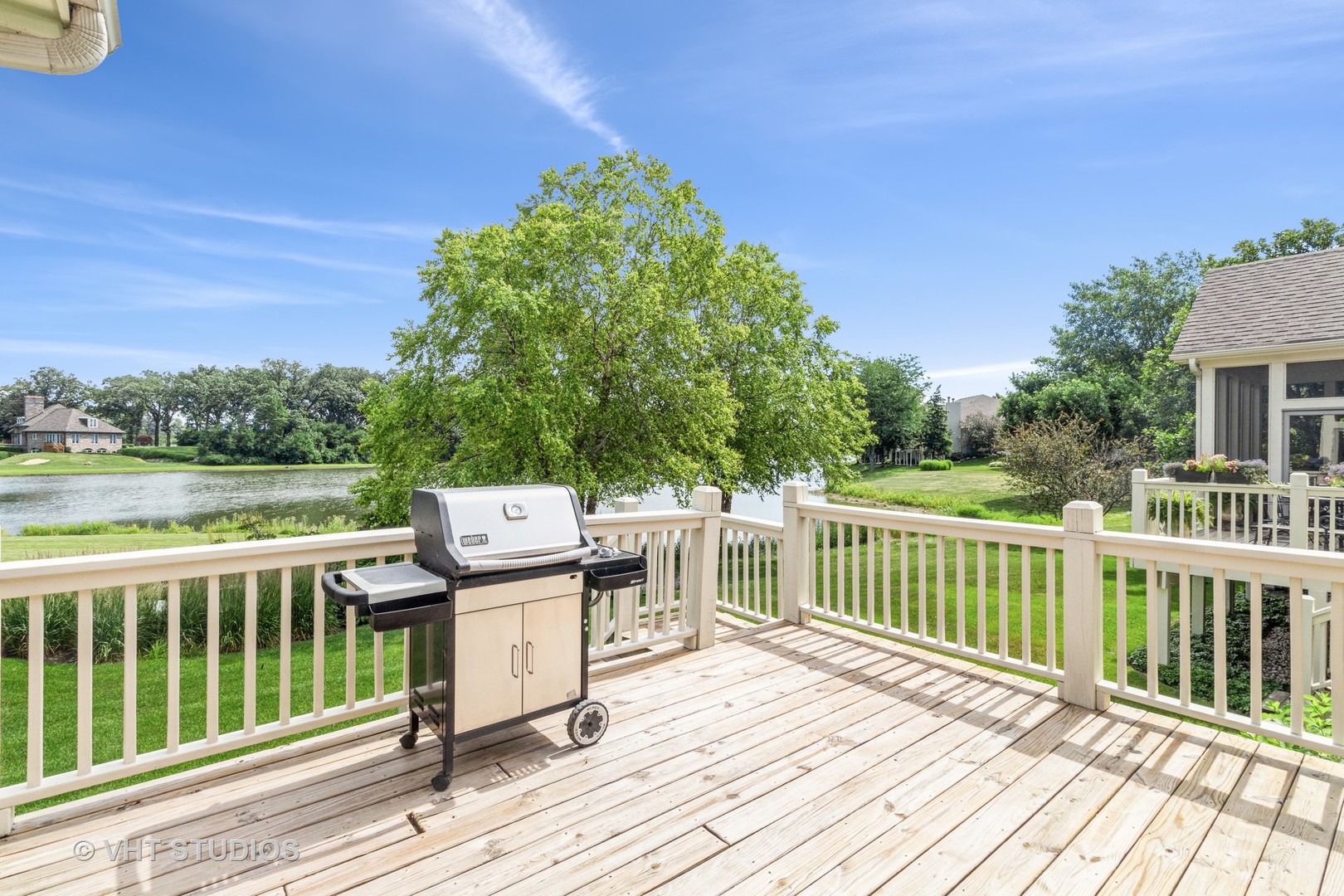1 Sugar Maple Court Lake In The Hills, IL 60156 - Photo 21 of 29 a view of a deck with wooden floor and fence next to a yard