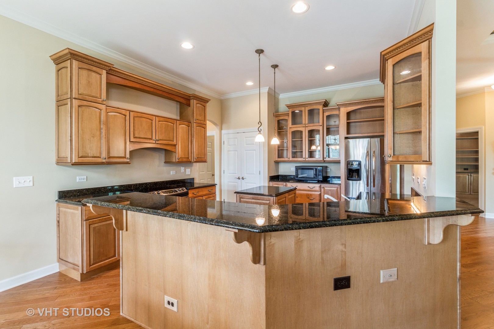 1 Sugar Maple Court Lake In The Hills, IL 60156 - Photo 6 of 29 a kitchen with stainless steel appliances granite countertop a stove a sink and a refrigerator