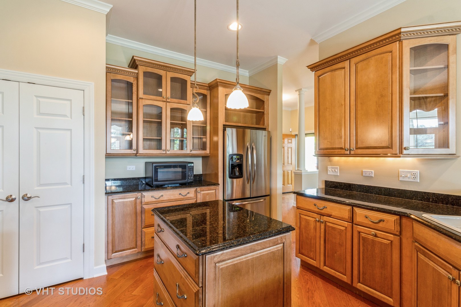 1 Sugar Maple Court Lake In The Hills, IL 60156 - Photo 8 of 29 a kitchen with stainless steel appliances granite countertop a sink stove and cabinets