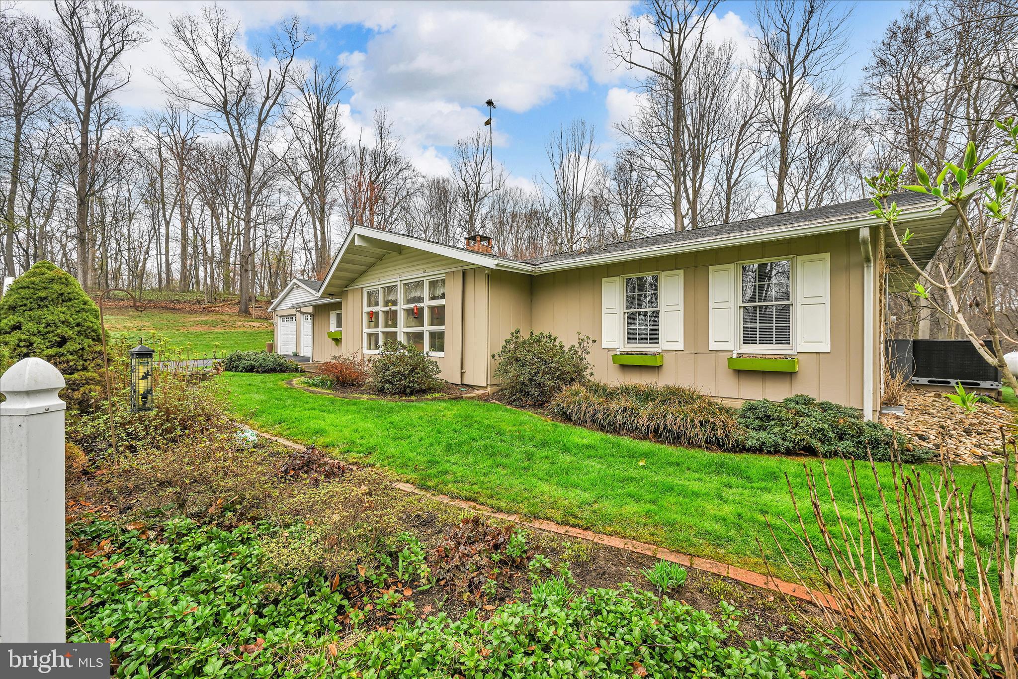 1534 Benton Hollow Road Drumore, PA 17518 - Photo 13 of 50 a front view of a house with a garden and plants