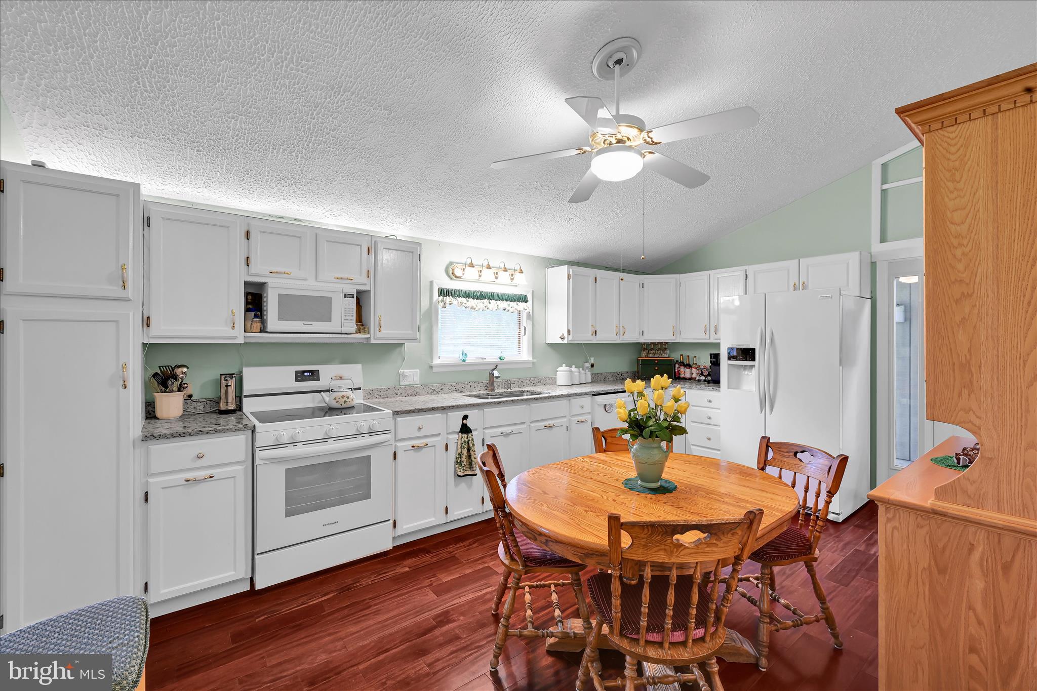 1534 Benton Hollow Road Drumore, PA 17518 - Photo 20 of 50 a kitchen with stainless steel appliances a dining table and chairs