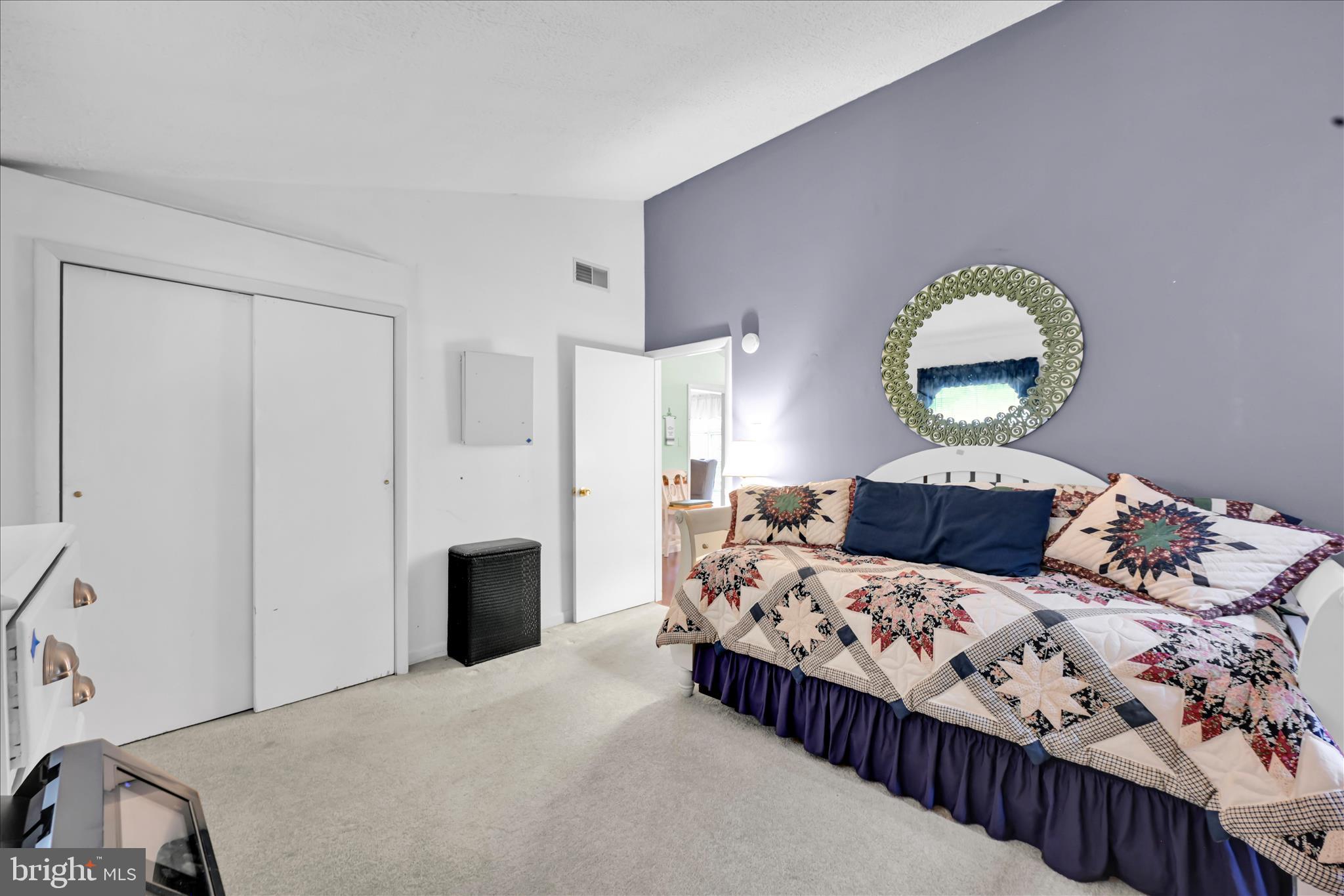 1534 Benton Hollow Road Drumore, PA 17518 - Photo 30 of 50 a bedroom with a bed and a mirror