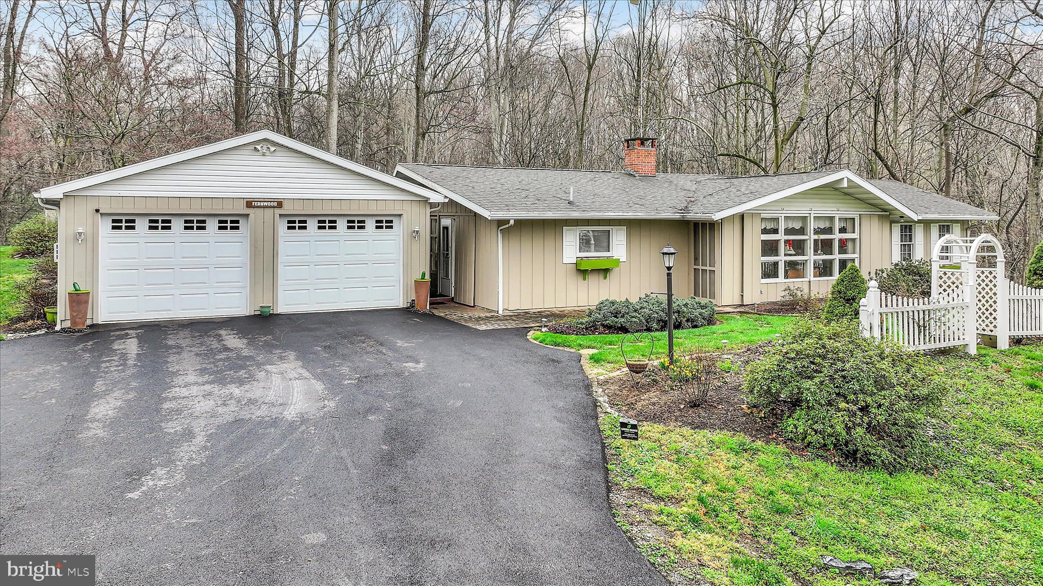 1534 Benton Hollow Road Drumore, PA 17518 - Photo 3 of 50 a front view of a house with a garden and plants