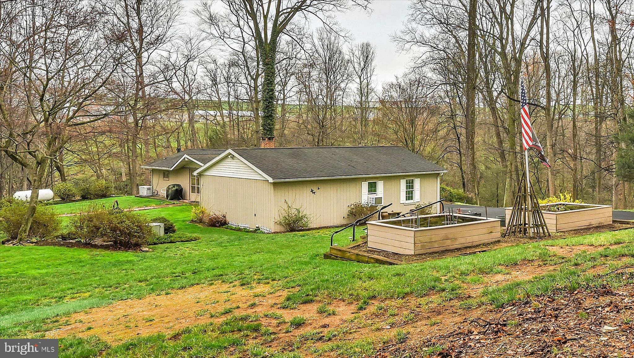 1534 Benton Hollow Road Drumore, PA 17518 - Photo 43 of 50 a front view of a house with a yard and trees